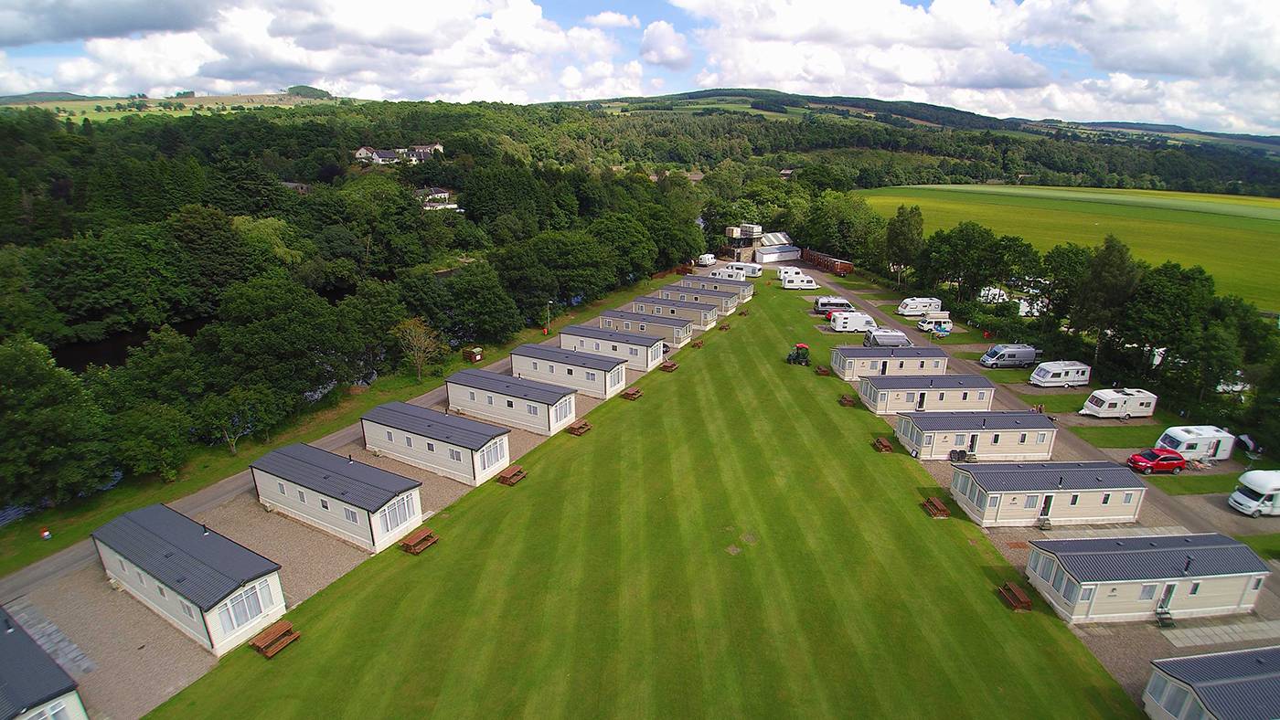 Arial View of holiday homes at Fonab Caravan Park with large green space in the middle