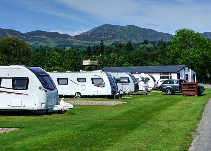 Rows of touring caravans next to the road at Fonab holiday site