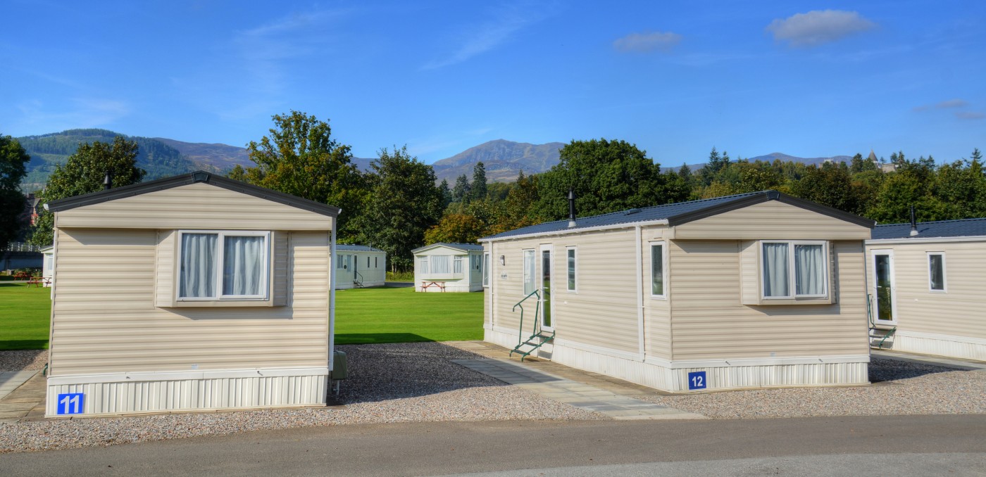 View from road of two static caravans next to each other