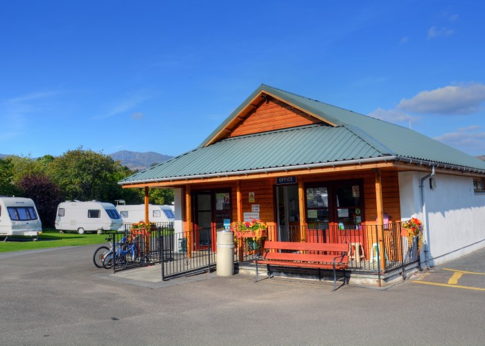 Outside of shop at Fonab caravan park with touring caravans in background