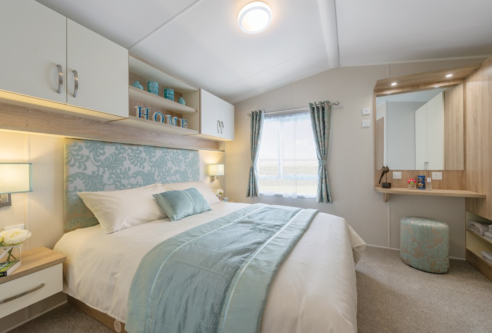 The 2016 Willerby Avonmore offers views of the grassy park from the large windows . It has two bedrooms and an open plan kitchen/living room layout. Bedroom 1 – Double, Bedroom 2 – Twin. All our caravans are built and fitted to the highest standards