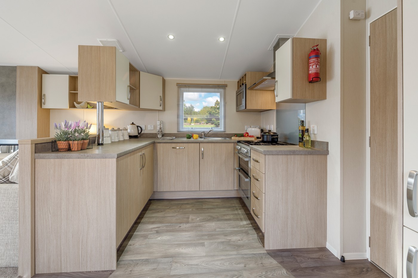 The 2016 Willerby Brockenhurst offers views of the grassy park from the large windows. It has two bedrooms and an open plan kitchen/living room layout. 
Bedroom 1 – Double
Bedroom 2 – Twin
