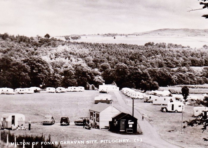 A historic photograph in black and white, a view of the caravan park from 1960 with old reception sheds in the foreground.
